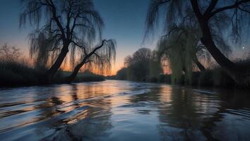 Scenic River Flowing with Reflections Under Evening Sky and Weeping Trees photo