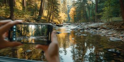 Capturing the beauty of a serene river in a forest during autumn while on a nature walk photo