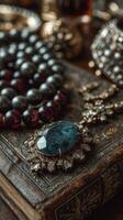 Intricate antique jewelry displayed on a vintage book in warm lighting showcases detailed craftsmanship and elegance photo
