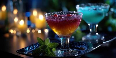 Colorful cocktails served in elegant glasses with garnishes, illuminated by soft candlelight at a nighttime gathering photo