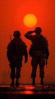 Soldiers salute at sunset during a military operation in a remote location photo
