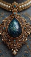 Intricate gold jewelry design featuring a large dark blue gemstone set against an elegant fabric background photo
