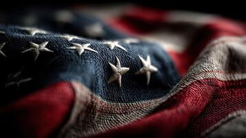 Close-up view of a weathered American flag showcasing its stars and stripes in soft natural light photo