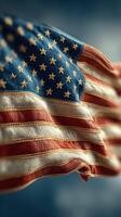 Waving American flag displays vibrant colors under a clear blue sky during a sunny day photo