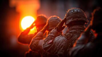 Soldiers saluting as the sun sets during a military ceremony honoring fallen comrades photo