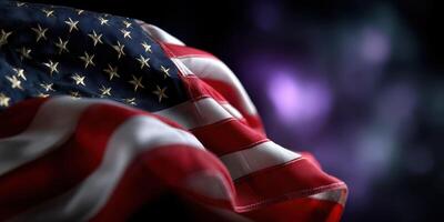 American flag waving gently in the breeze with stars and stripes visible against a dark background photo