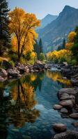 Vibrant autumn landscape along a serene river in the mountains with golden trees photo