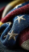 Woven fabric with stars and stripes in deep blue and red colors displayed in artistic arrangement photo