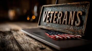 Sign honoring veterans placed on a rustic wooden table beside an American flag during a dimly lit setting photo