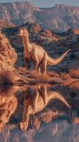 Dinosaur stands by a serene lake surrounded by rocky mountains during sunset photo