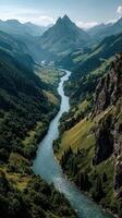 Breathtaking view of a winding river surrounded by lush mountains and greenery in the early afternoon photo