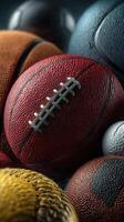 Collection of assorted sports balls including a red football, arranged artistically for a detailed close-up view photo