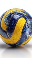 Unique design of a volleyball showcasing vibrant blue and yellow colors with a textured surface in bright lighting photo