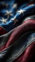 Wavy American flag showcasing red, white, and blue colors under soft lighting in a close-up perspective photo