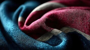 Detail of textured fabric with red, blue, and white colors displayed in a close-up view showcasing the weave and contrast of the materials photo