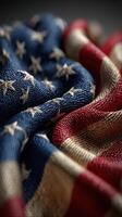 Stars and stripes of the American flag draped gracefully in rich fabric textures photo