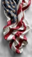 Elegant display of a folded American flag highlighting its detailed design and rich colors against a simple background photo