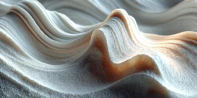 Sand pattern formed by wind at a beach during sunset creating natural curves and shadows photo