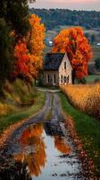 Beautiful autumn landscape with a rustic stone house, vibrant trees, and a winding road in the countryside at sunset photo
