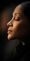 Woman with closed eyes enjoying a moment of peace in natural light photo