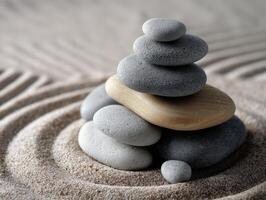 Serene stone arrangement in sand with soothing patterns in a tranquil setting photo