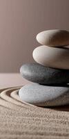 Stacked stones create harmony in minimalist zen garden setup photo