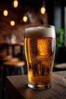Craft beer served in a chilled glass at a cozy pub in the evening photo