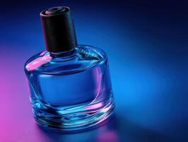 Colorful glass perfume bottle displayed on a table with gradient lighting photo