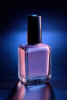 Colorful nail polish bottle on a dark background with blue light photo