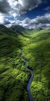 Breathtaking aerial view of a lush green valley with a winding river photo