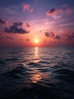 Beautiful sunset over calm ocean waves painted in vibrant colors photo