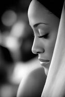 Profile of woman with closed eyes wearing headscarf near window photo