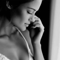 Monochrome portrait of thoughtful woman near window in the morning photo