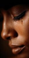 Close Up Portrait of Woman Crying with a Tear on her Cheek photo