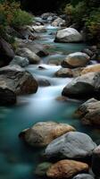 Mountain river flows among rocks and green trees during the day photo