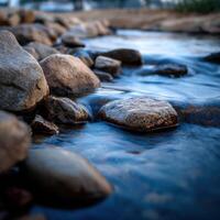Water Stream Flowing Over Rocks during the Evening photo