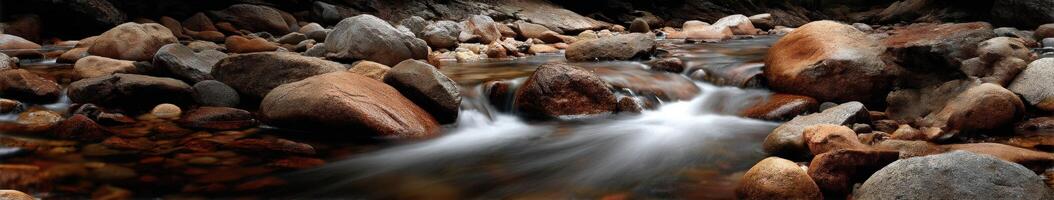 Stream of water flows through a rocky riverbed at Yosemite photo