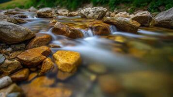 Water flowing over rocks in a mountain stream during daytime photo