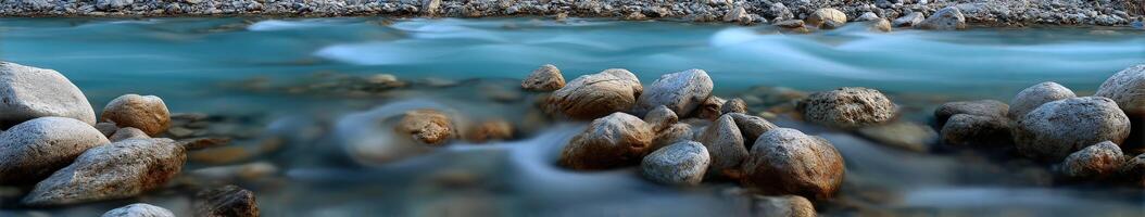 Mountain stream flowing over Rocks in the early morning photo
