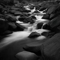 River flows swiftly through rocky terrain in Yosemite National Park photo