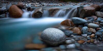 Slow stream cascading over rocks in the cascade mountains photo