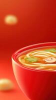 Asian soup closeup. Noodles in red bowl on solid background. For healthy lifestyle marketing use photo
