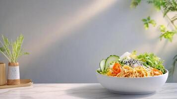 Balanced meal salad and spaghetti in bowl on table, plants, sunlight background. Use for food blogging photo