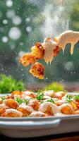 Cauliflower bites dripping sauce, garden background, suitable for food blog, website, recipe photo