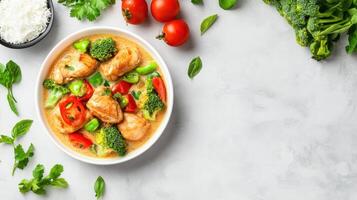 Chicken and veggies are cooked in broth on a clean surface, copy space for nutrition blog photo