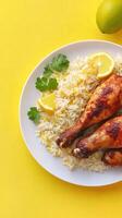 Chicken with rice and lemon, in kitchen, ready to eat. For cookbook or food blog photo