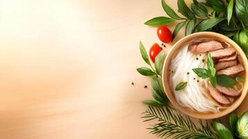 Delicious noodle soup with meat slices on a wooden table surrounded by greenery. Food blog image photo