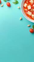 Fresh Tomato Soup. Cubes of tofu sit in a bowl with colorful background, top view for healthy vegan eating photo