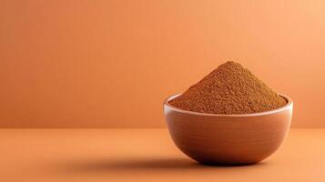 Ground spice in bowl for cooking. Background is clean for use in recipes and presentations photo
