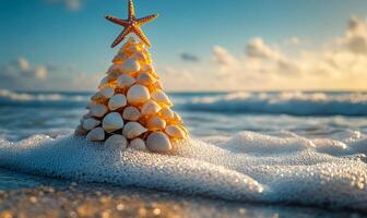 Seashells bring beachy cheer. A unique holiday tree made of seashells sits on the shoreline, with waves gently washing around it under a colorful sky. photo